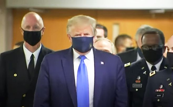 In a first, Trump dons anti-COVID-19 mask