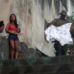 A PICTURE AND ITS STORY-The despair of a Rio widow, in a city struggling with violence
