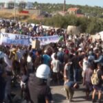 Police fire teargas as migrants demand to leave Greek island after fire