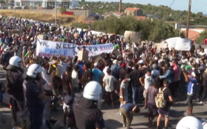 Police fire teargas as migrants demand to leave Greek island after fire