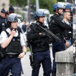 French police shoot dead man who slit teacher's throat