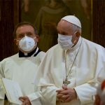 Pope wears mask for first time at public service