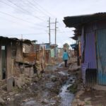 Man-walking-in-Mukuru-slum