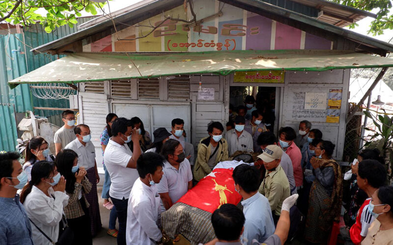 People attend the funeral of Kyaw Win Maung