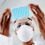 Woman examining laboratory samples