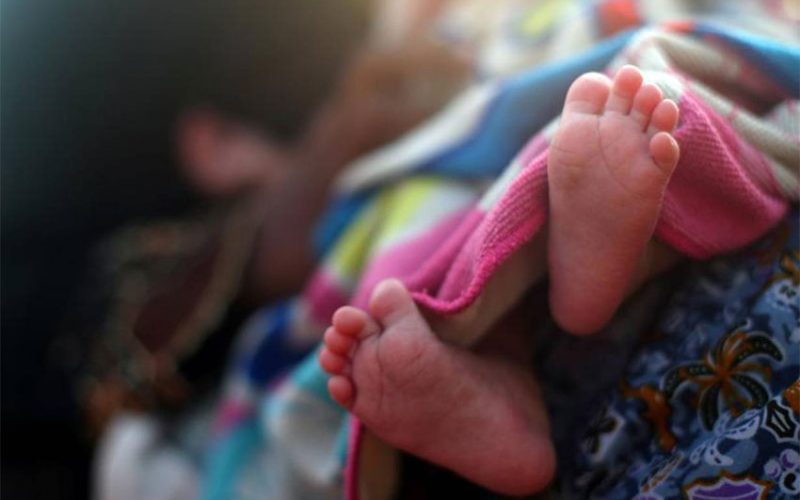 The feet of a newborn Rohingya refugee baby