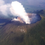 An_aerial_view_of_the_towering_volcanic_peak_of_Mt