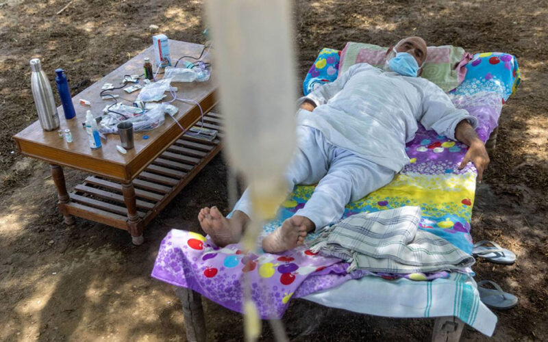 Under a tree, one Indian village cares for its COVID-19 sick