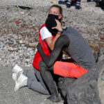 Luna-Reyes-Spanish-Red-Cross-embraces-and-comforts-a-migrant-Sub-Saharian