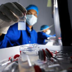 lab-technician-holds-a-vial-of-Chinas-Sinovac-COVID-19-vaccine