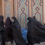 Afghan-women-walk-at-a-mosque-in-Herat