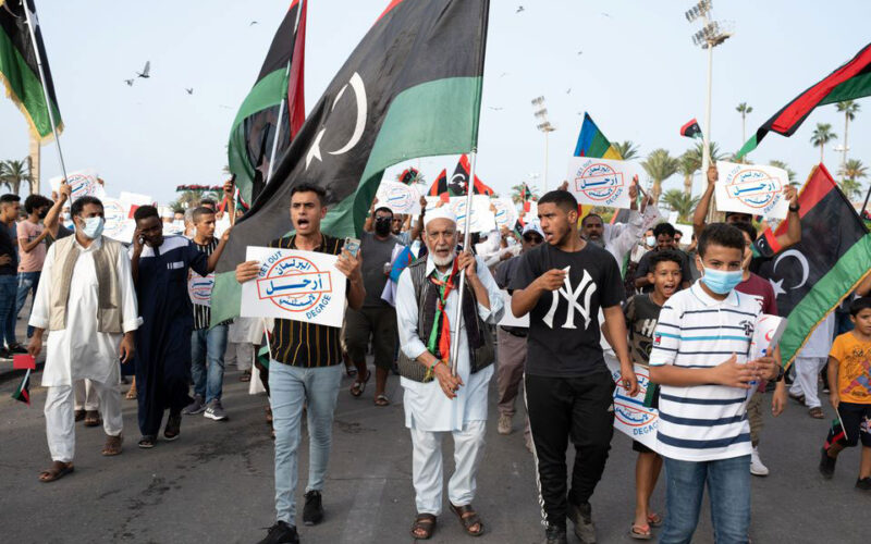 Libya PM draws crowd for mass wedding and protest against parliament