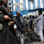 Taliban-security-member-with-rifle