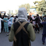 Taliban-soldier-_-protesters
