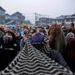 Kashmiri-Muslim-women-wearing-face-masks-pray