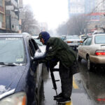 Taliban-fighter-searches-a-car_Kabul