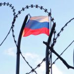Russian-flag-behind-a-razor-wire-fence