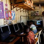Alfred-Ouma-stands-at-his-cybercafe-business