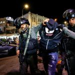 Israeli-security-force-members-detain-a-protester