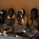 Pupils-in-a-school_pray_Nairobi_Kenya
