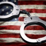 US-flag-with-handcuffs