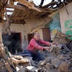 Ukrainian-man-removes-debris-from-his-house