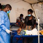 Malawi_health-worker-attending-to-a-patient