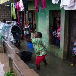 woman-removes-water-from-her-house