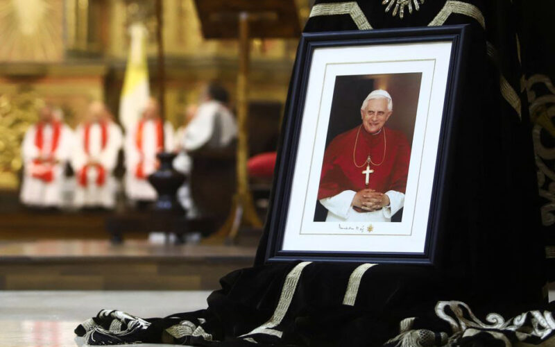 Supporters demand sainthood for Benedict as Pope Francis leads funeral