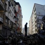 Turkey_man-stands-on-rubble