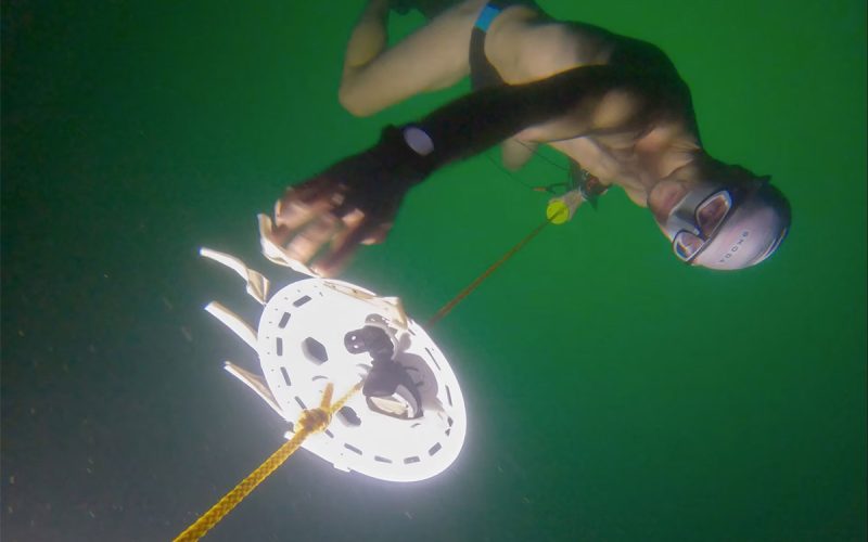 Free-diver plunges to record depth beneath frozen Swiss lake