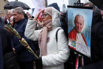 Poles march to defend Pope John Paul II against abuse cover-up accusations
