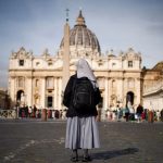 nun-stands-in-front-of-St.-Peters-square