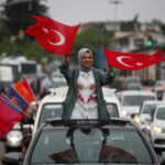A-woman-waves-Turkish-flags