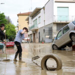 Italy-floods_Residents-remove-mud-and-debris