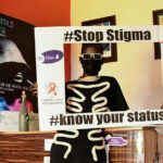 HIV-AIDS-patient-holds-an-advocacy-placard