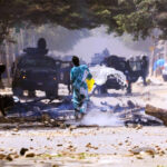 People-put-out-burning-barricades_Dakar_Senegal