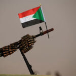 Sudanese-national-flag-is-attached-to-a-machine-gun