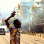 activists-reacts_riot-police_teargas