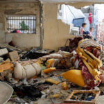 Palestinian-girls_damaged-house