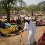 Sudanese-men_makeshift-shelters