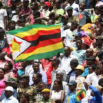 Zimbabwe-flag-and-crowd-of-people