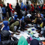 Spanish-classes-to-migrants_Las-Raices-Camp
