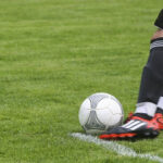 player-kicking-football