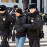 Moscow_Police-officers-detain-a-person