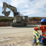 miner-and-giant-excavator