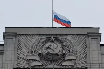 Russians lower flags, lay flowers to honour concert hall attack victims