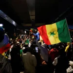 Supporters of Senegalese presidential candidate Bassirou Diomaye Faye celebrate
