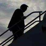 Donald Trump boards his plane