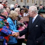 King Charles and Queen Camilla greet people